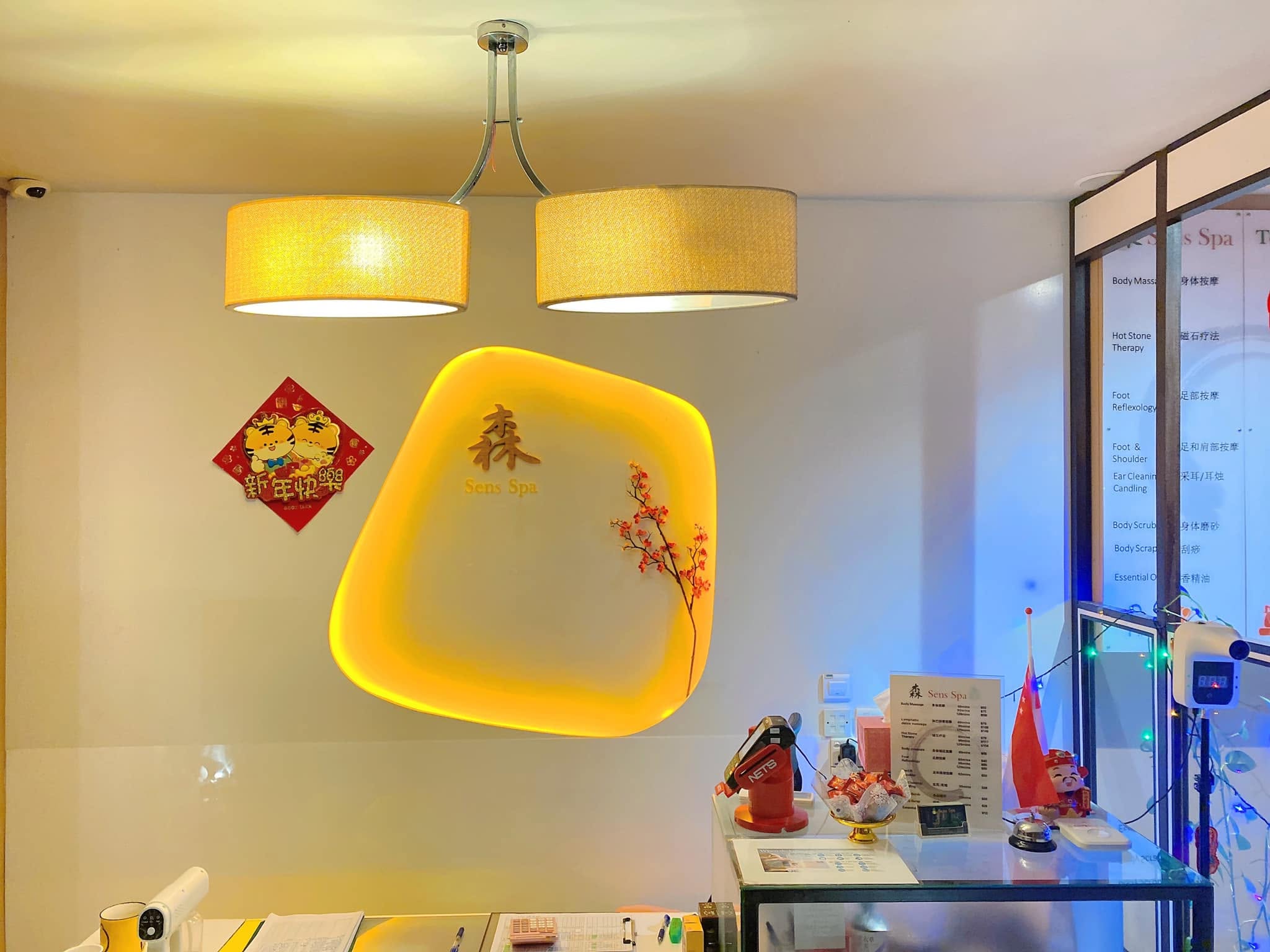 Warm spa interior with illuminated Sens Spa wall art